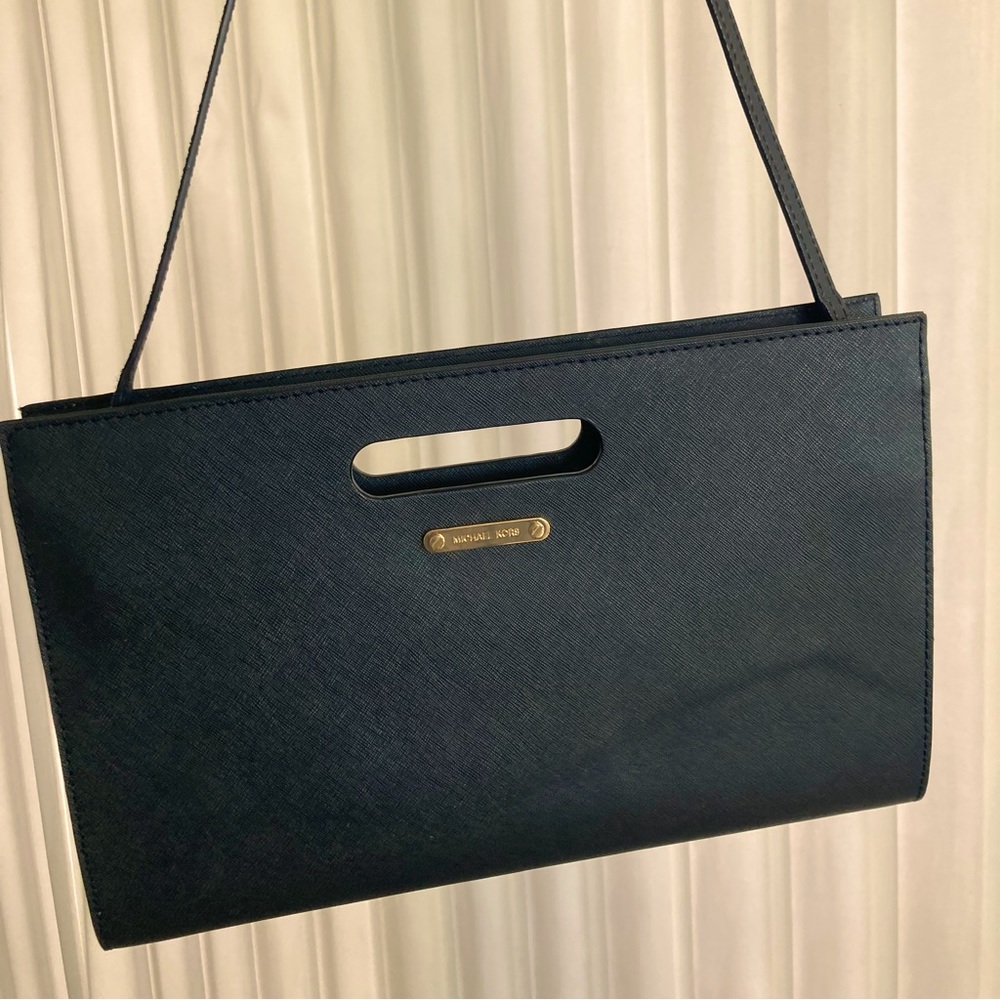 Michael Kors clutch with shoulder strap. Can be worn as shoulder bag or clutch